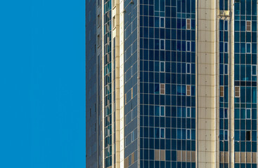 Wall Mural - many windows and walls facade of a modern skyscraper without people