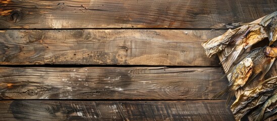 Poster - Wooden background with copy space image featuring dried fish