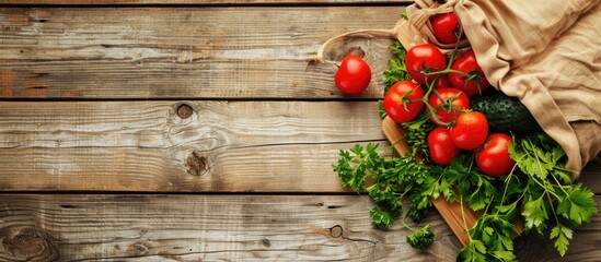 Poster - Fresh vegetables in a reusable shopping bag from a grocery farm shop beside a chopping board on a vintage wooden table ready for making salad Includes copy space image