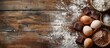 © HN Works - Messy baking preparation with love featuring ingredients like egg flour and dark cooking chocolate on a wooden rustic table with a copy space image