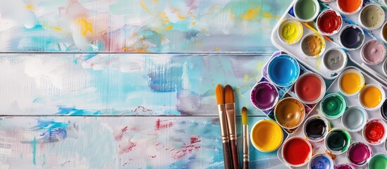 Aufkleber - Art supplies like watercolor paints and brushes on a table with room for text Creative flat lay image with copy space for writing