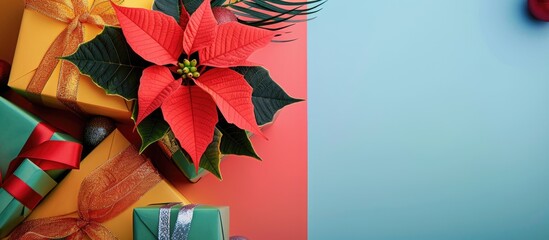 Poster - A festive scene with a poinsettia flower and New Year s gifts arranged on a colorful background creating a perfect copy space image