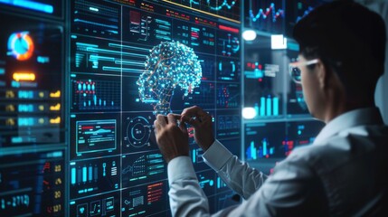 A man is working on a computer screen with a brain image