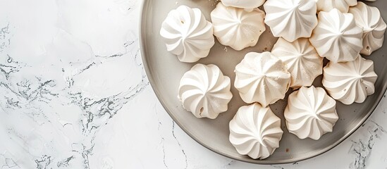 Aufkleber - Top view of a white marble table with a tray of delicious meringue cookies Ideal for adding text with copy space image