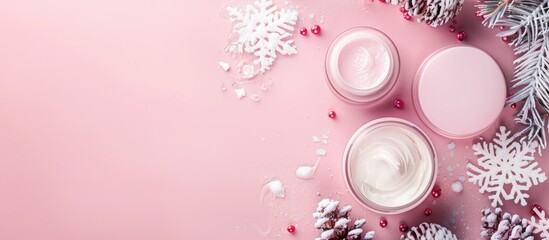Poster - Winter skin care products displayed on a pink background with copy space image