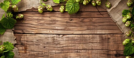 Aufkleber - Rustic wooden surface with hops and sackcloth on it ideal for product display with copy space image