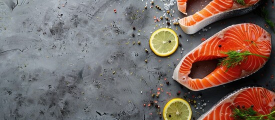 Poster - Top view of fresh raw salmon steaks with lemon and dill on a gray background perfect for cooking with room for text in the image. Creative banner. Copyspace image
