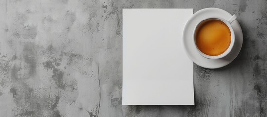 Poster - Top view of a mockup featuring blank paper and a cup of coffee on a gray concrete background perfect for adding your own content in the copy space image