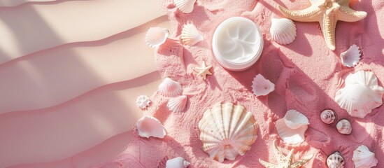 Aufkleber - Flat lay with suntan cream seashells and a marble pebble sun on a pink backdrop providing ample copy space image