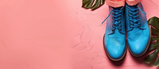 Sticker - Stylish women s boots featured in a fashion color scheme with blue sneakers showcased on a light pink background creating an appealing copy space image