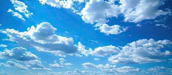 Aufkleber - The expansive blue sky with fluffy clouds creates a serene copy space image