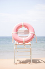 Wall Mural - Pink lifeguard chair on the beach