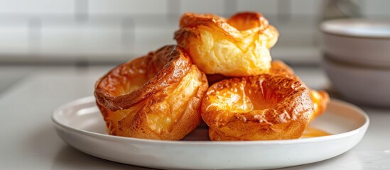 Aufkleber - Yorkshire pudding on a plate with a light tile background creating a pleasing copy space image