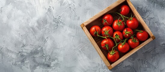 Poster - Wooden box filled with vibrant red tomatoes on a light backdrop highlighting eco friendly theme and shot from above for copy space image
