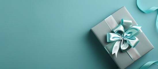 Poster - A festive banner with a Father s Day greeting card on a blue background placed beside a gray gift box The banner includes copy space image