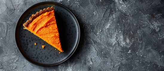 Poster - Top view of a vegan raw carrot cake on a gray stone surface with copy space and selective focus showcasing a slice of healthy homemade cake