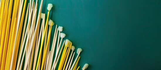 Aufkleber - Floss toothpicks on a background with copy space image in yellow and green tones