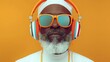 © Andrea Marongiu - Stylish Jamaican dub musician; senior black man wearing headphones and sunglasses, enjoying music on a vibrant yellow background. a sense of timeless cool and the joy of music across generations