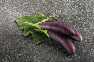 Raw ripe organic eggplant with leaf