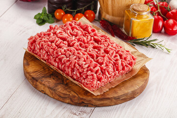 Poster - Raw minced beef meat over board