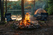 © StokHunt - A beautiful bonfire with burning wood next to chairs and a camping tent in the forest. Camping. Vacation. Holidays. Rest.