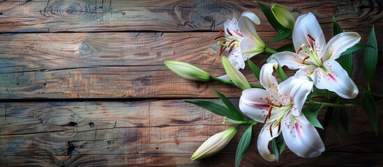 Aufkleber - A beautiful lily flower against a rustic wooden backdrop with copy space image
