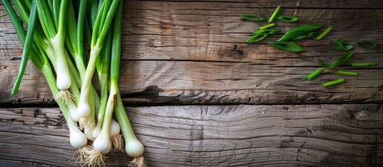 Wall Mural - Wooden backdrop featuring fresh green onions room for text ideal for a copy space image