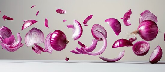 Poster - Red onion slices falling with copy space image on white backdrop