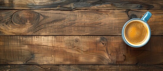 Top view concept photo of a cup of coffee on a wooden surface with space for text or other images. image with copy space