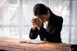 © David - Hands folded in prayer on a Holy Bible in church concept for faith, spirituality and religion, woman praying on holy bible in the morning. woman hand with Bible praying.