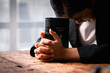 © David - Hands folded in prayer on a Holy Bible in church concept for faith, spirituality and religion, woman praying on holy bible in the morning. woman hand with Bible praying.