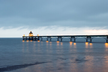 The Grade 1 listed 'Cleveland Pier' in the Bristol Channel illuminated at dusk