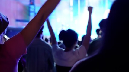 Wall Mural - People waving hands at the concert, slow motion video