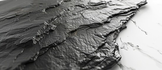 Wall Mural - Texture of black slate on a white marble surface with copy space image