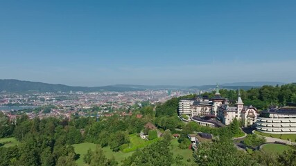 Wall Mural - Aerial view over Swiss City of Zürich with woodland, cityscape and Lake Zürich on a sunny summer morning. Movie shot August 6th, 2024, Zurich, Switzerland.