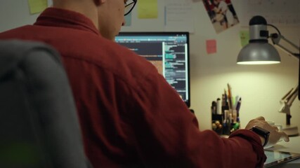 Technologies. An experienced specialist, using intelligence programs, making edits at computer monitor. An ambitious student corrects the program code, creates artificial intelligence, web development