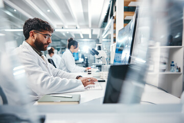 Fototapete - Scientist, man and typing in laboratory on computer for medical results, investigation and pharmaceutical research. Male person, science and innovation for clinical study, review and development.
