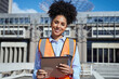 © Meeko Media - Confident Female Construction Worker Holding Clipboard at Building Site