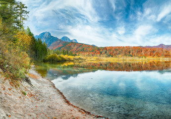 Wall Mural - breathtaking autumn scene of sunny morning on almsee lake.