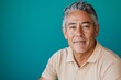 © World of AI - mature Hispanic man with salt and pepper hair, seated and relaxed, wearing a beige polo shirt, dark blue background