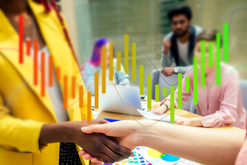 Wall Mural - A woman is giving a presentation in front of a group of people