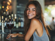 © alfa27 - A woman is smiling and holding a wine glass