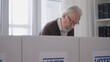 © Synthex🇺🇦 - Elderly male citizen voting at a polling station, democratic elections, liberty