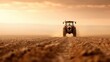 © DuangphonKPR - A tractor parked in a dusty, barren field with no sign of water