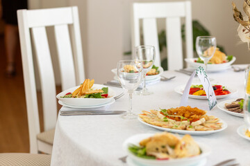 Wedding banquet in restaurant, covered round table for guests