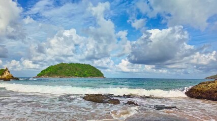Fototapete - Slow motion video of the waves hitting the reef along Yanui Beach. The aqua blue sea.
the clean sea and quiet with white sand beach. Amazing place of tourist attractions. Snorkeling location.