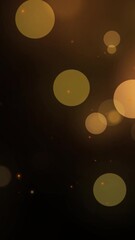 Wall Mural - Abstract Gold blurry bokeh background with lights particles on dark background. Defocused photo effect. Slow motion vertical animation