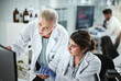 © peopleimages.com - Computer, research and manager with scientist in laboratory for pharmaceutical innovation with drug trial. Review, help and mentor with biomedical student with internship for analytical chemistry.