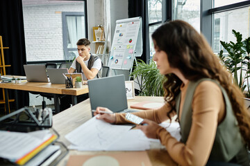 Wall Mural - Two professionals engage thoughtfully in office.