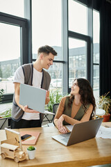 Wall Mural - Two colleagues converse calmly in office.